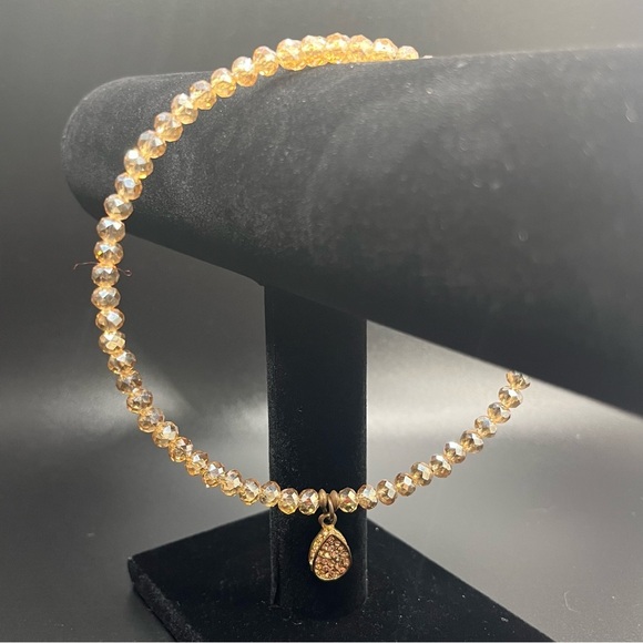 Modern light amber colored crystal choker with a teardrop rhinestone pendant. - Picture 6 of 9